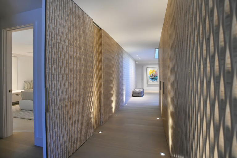 Integrated lighting and architectural hallway details in a Longport beachfront smart home