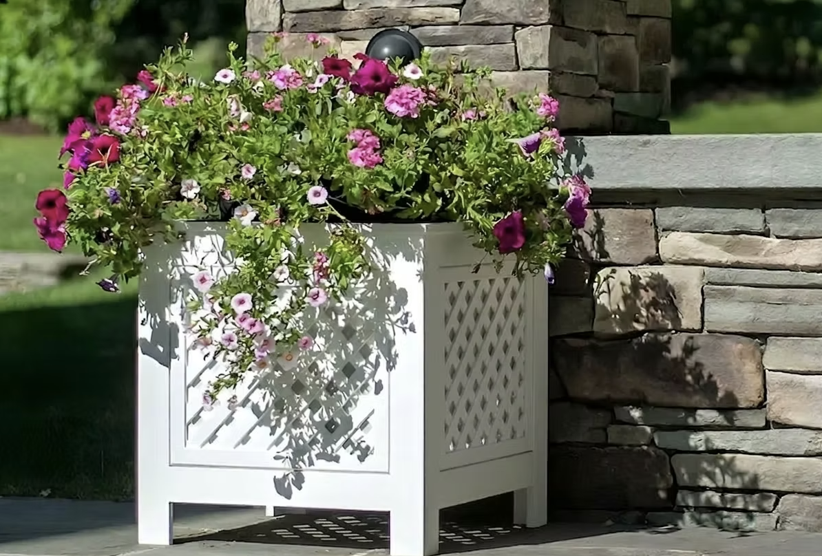 Plant-A-Speaker outdoor planter speaker integrated into a patio landscape