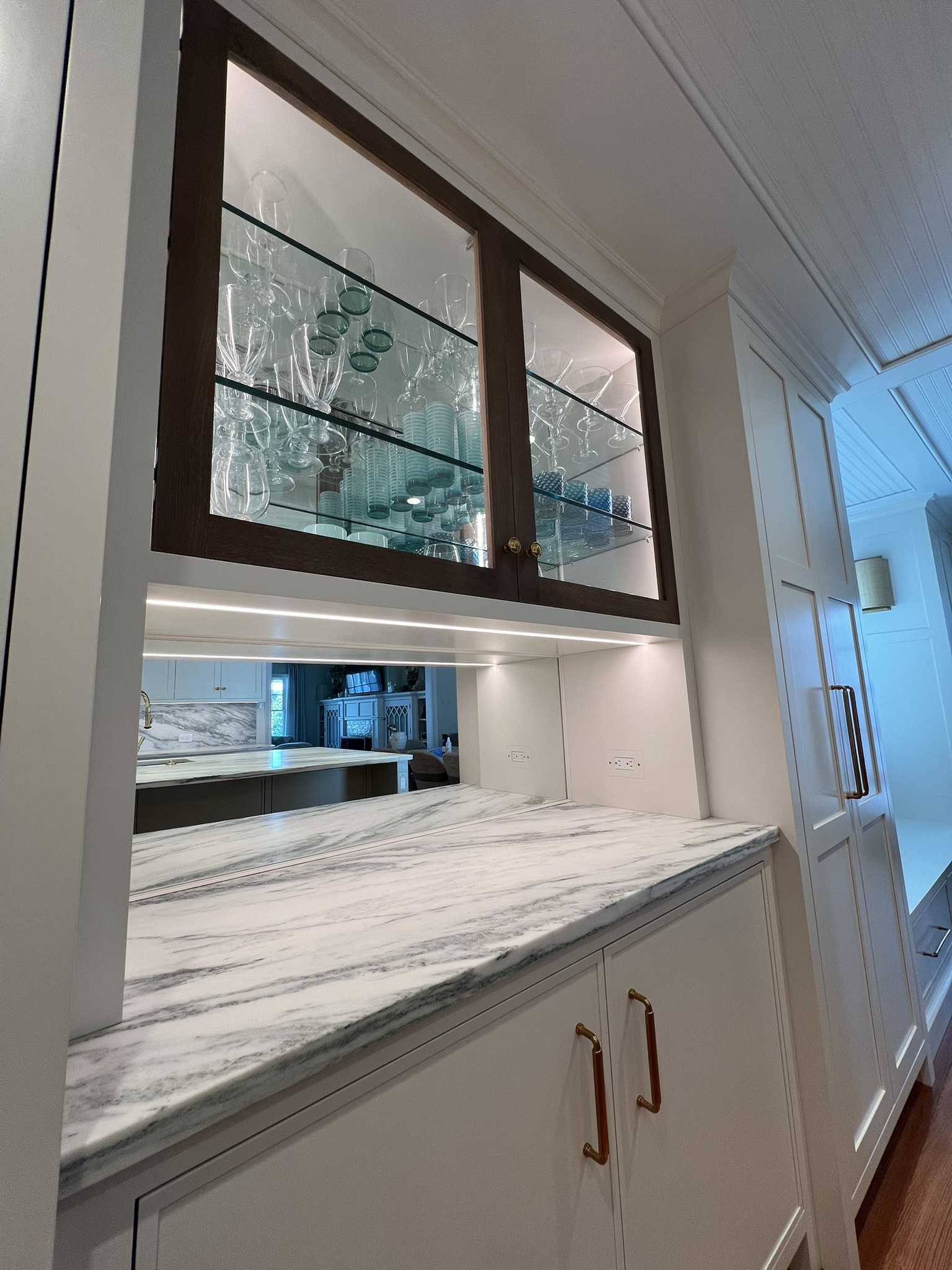 Integrated Lumaris cabinet and task lighting in a custom Stone Harbor kitchen