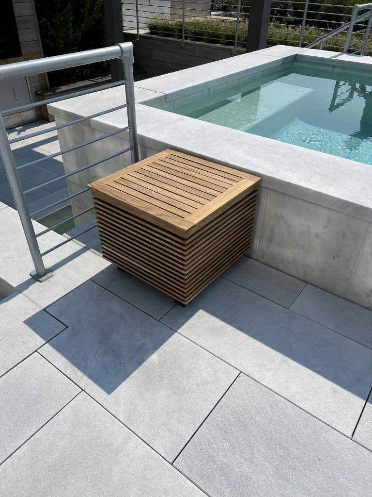 Plant-A-Speaker custom outdoor speaker end table beside a hot tub