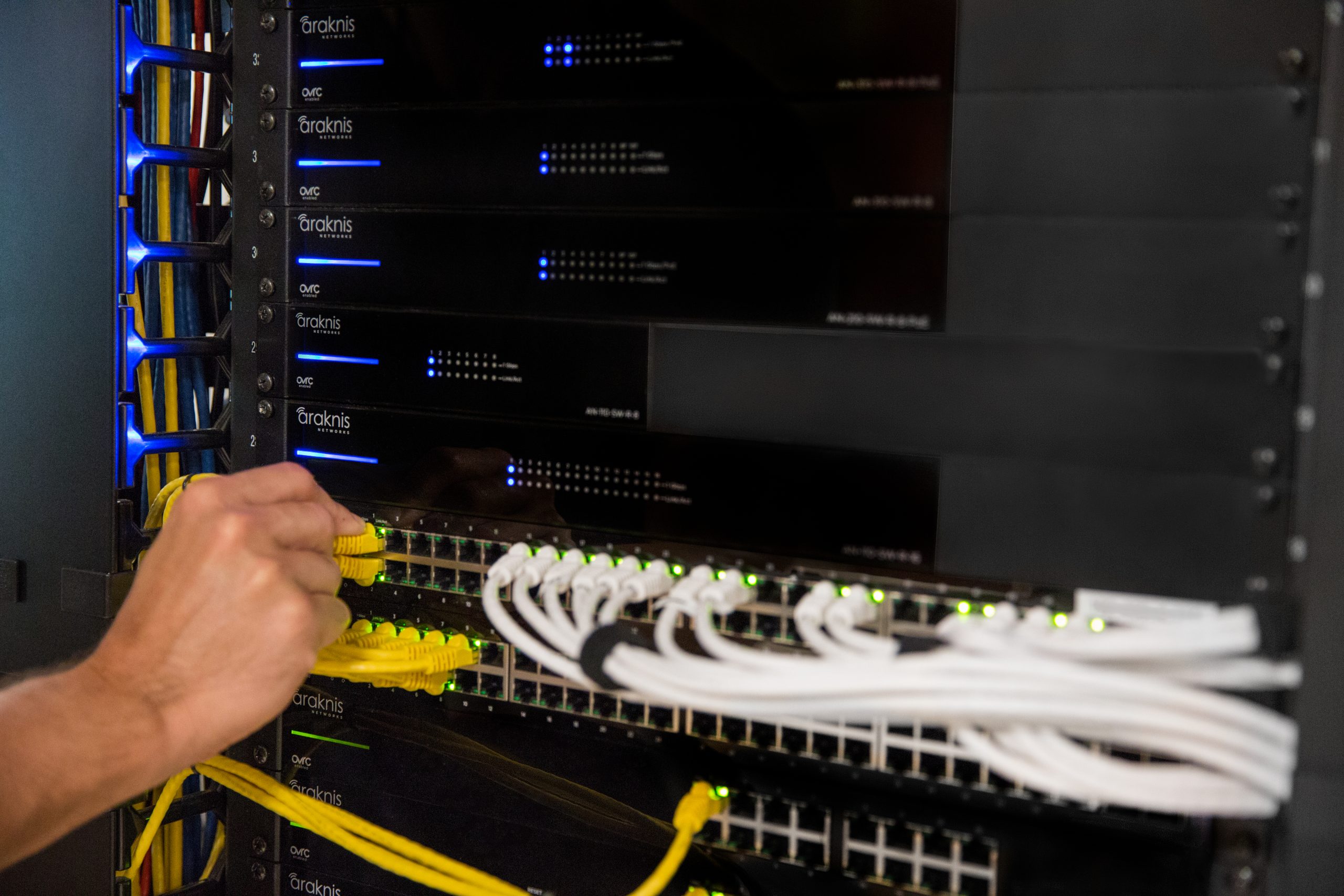 Technician evaluating existing smart home equipment for network and support planning